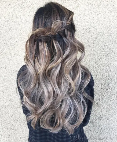 wavy hairstyle with halfup waterfall braid