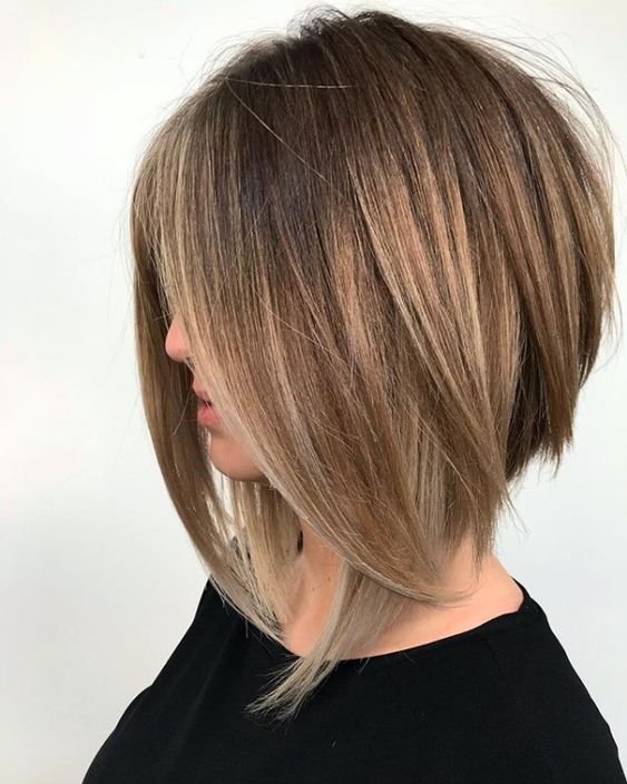 Angled blunt bob hairstyle with shorter hair in the back.Angled blunt bob hairstyle with shorter hair in the back.