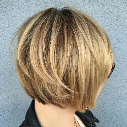 Layered bob haircut with different hair lengths for texture and movement.