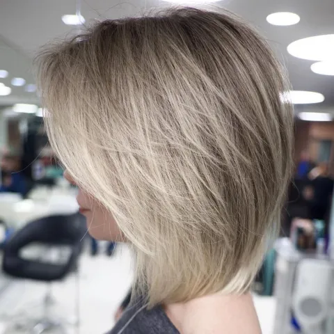 Layered bob haircut with different hair lengths for texture and movement.