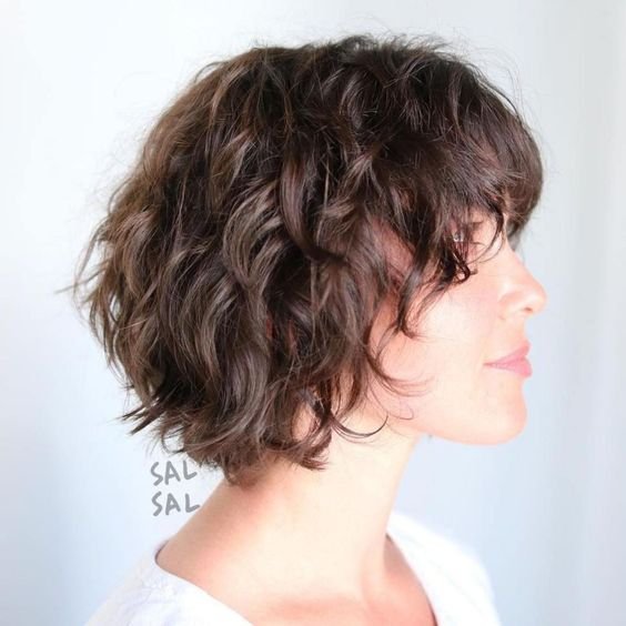 Wavy shaggy bob hairstyle with defined waves.