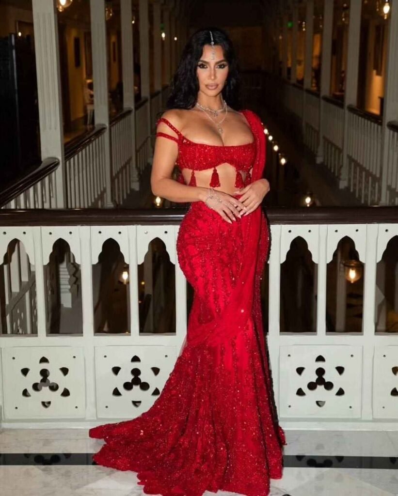 Kim Kardashian in a stunning red traditional Indian outfit at the Ambani wedding.