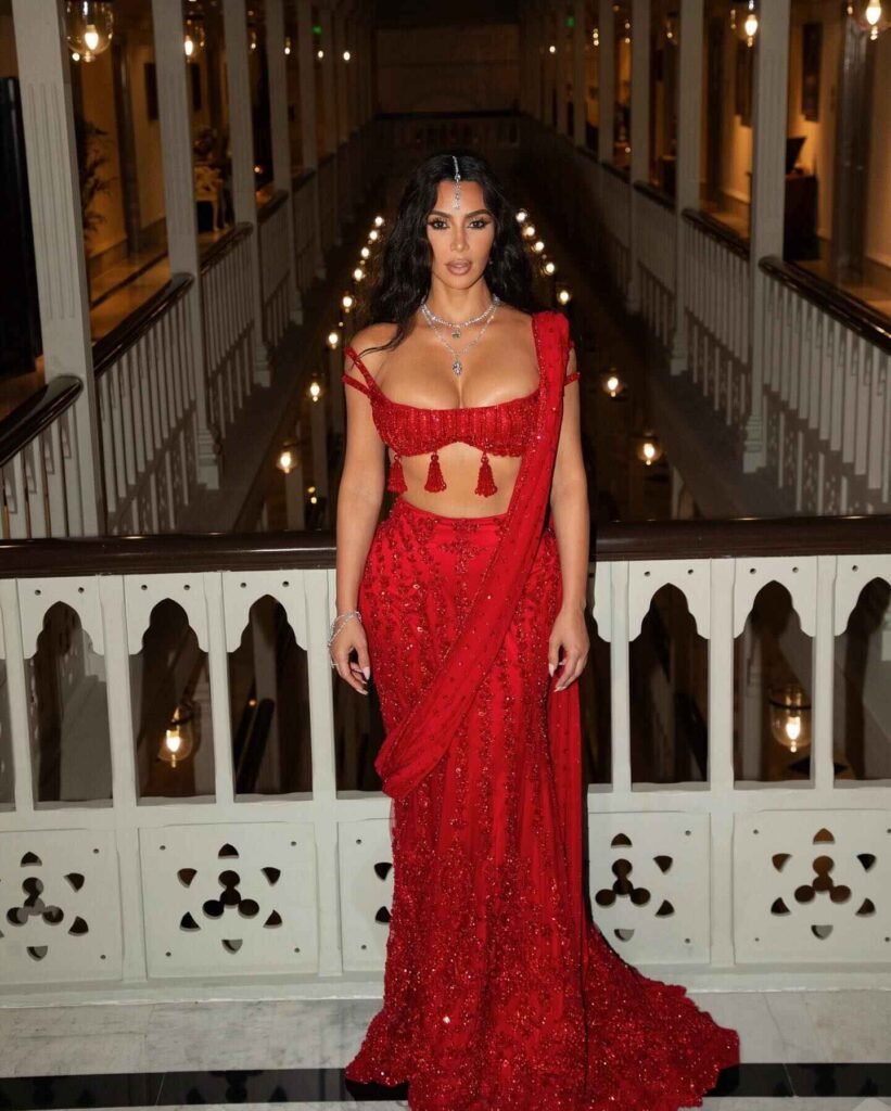 Kim Kardashian in a stunning red traditional Indian outfit at the Ambani wedding.