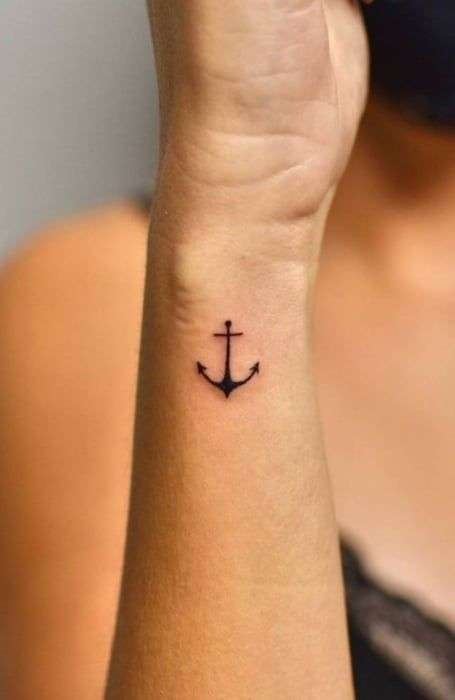 An anchor tattoo symbolizes stability, strength, and grounding. It's a popular choice for those who want a reminder to stay steady in life's storms. minimalist anchor tattoo, small anchor tattoo designs, simple nautical tattoos