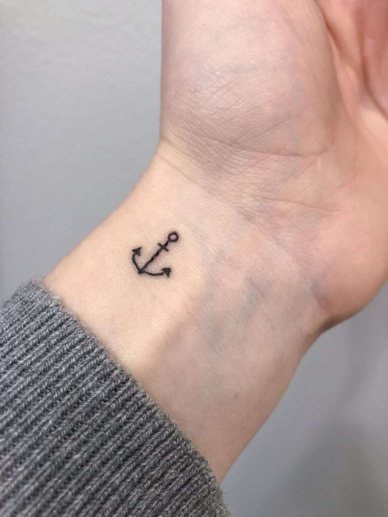 An anchor tattoo symbolizes stability, strength, and grounding. It's a popular choice for those who want a reminder to stay steady in life's storms. minimalist anchor tattoo, small anchor tattoo designs, simple nautical tattoos