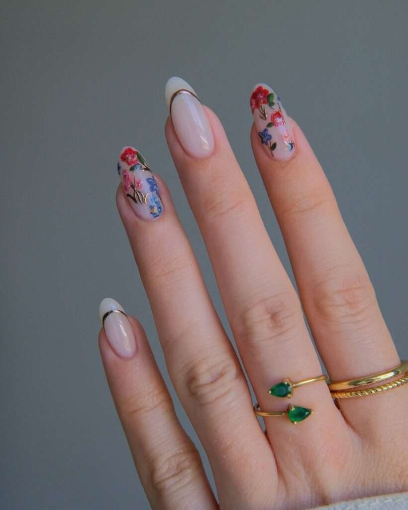 Fall-inspired nail art with floral designs and nude shades.