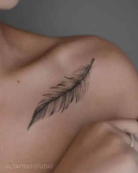 A feather tattoo is light, delicate, and often represents freedom, hope, or a connection to the spiritual world. It's a beautiful minimalist choice.minimalist feather tattoo, small feather tattoo designs, simple feather tattoos