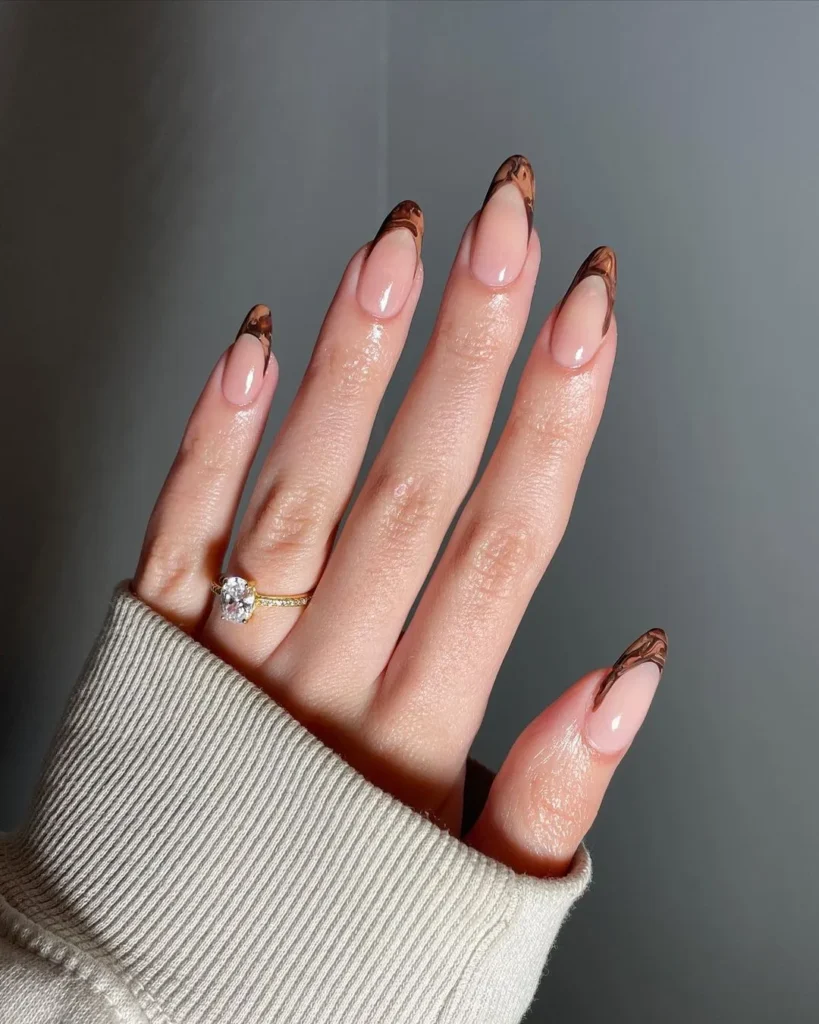 Fall-inspired French manicure with brown marble tips