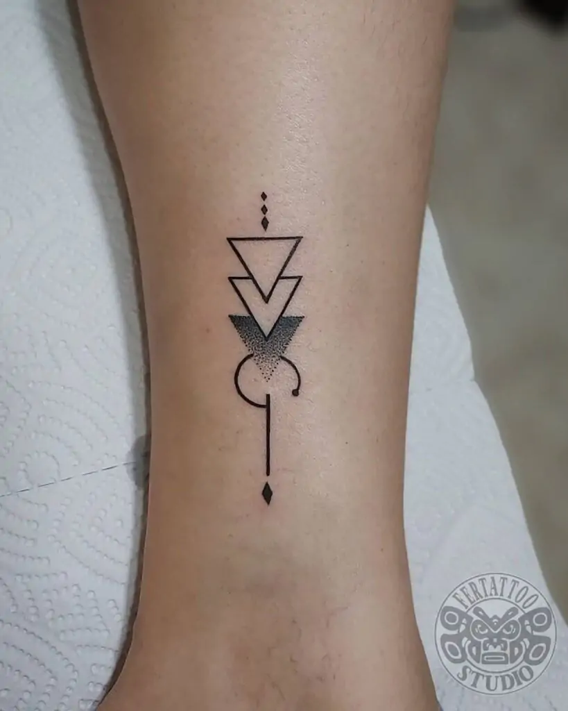 Geometric shapes like triangles, circles, or squares make for striking minimalist tattoos. They are clean, sharp, and can symbolize balance, harmony, and stability.