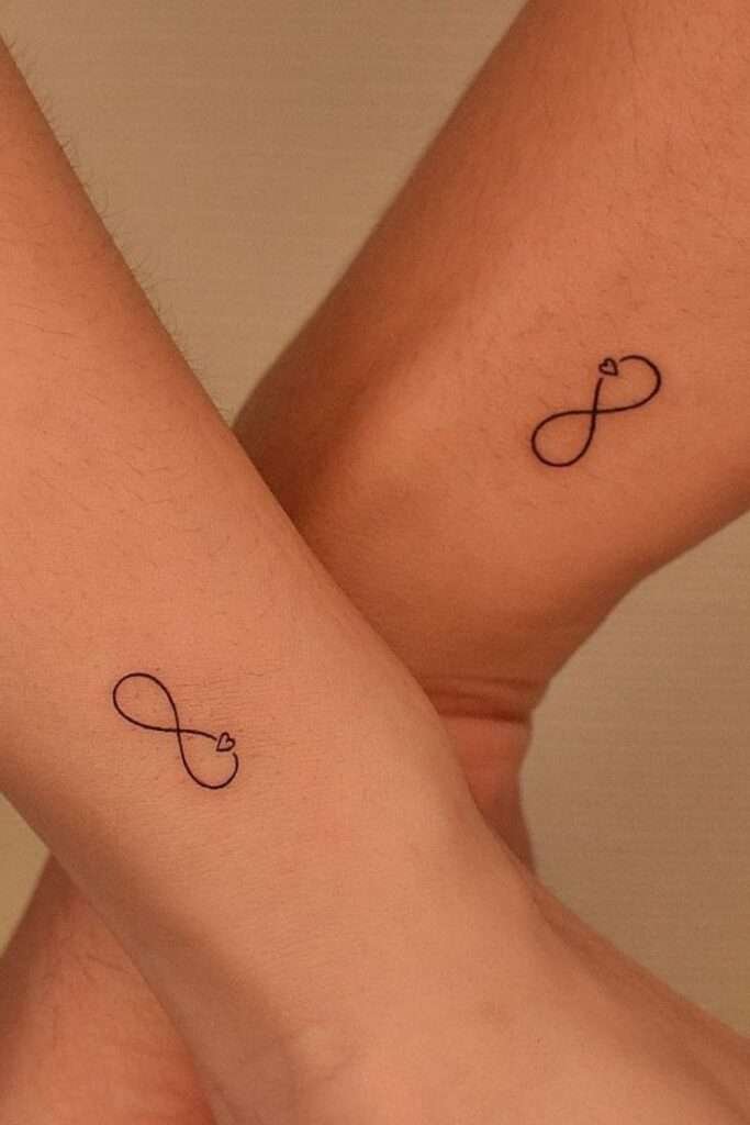 The infinity symbol is a simple yet powerful design representing eternity, endless love, or boundless possibilities. It's a popular choice for minimalist tattoos. minimalist infinity tattoo, small infinity tattoo ideas, simple infinity tattoos