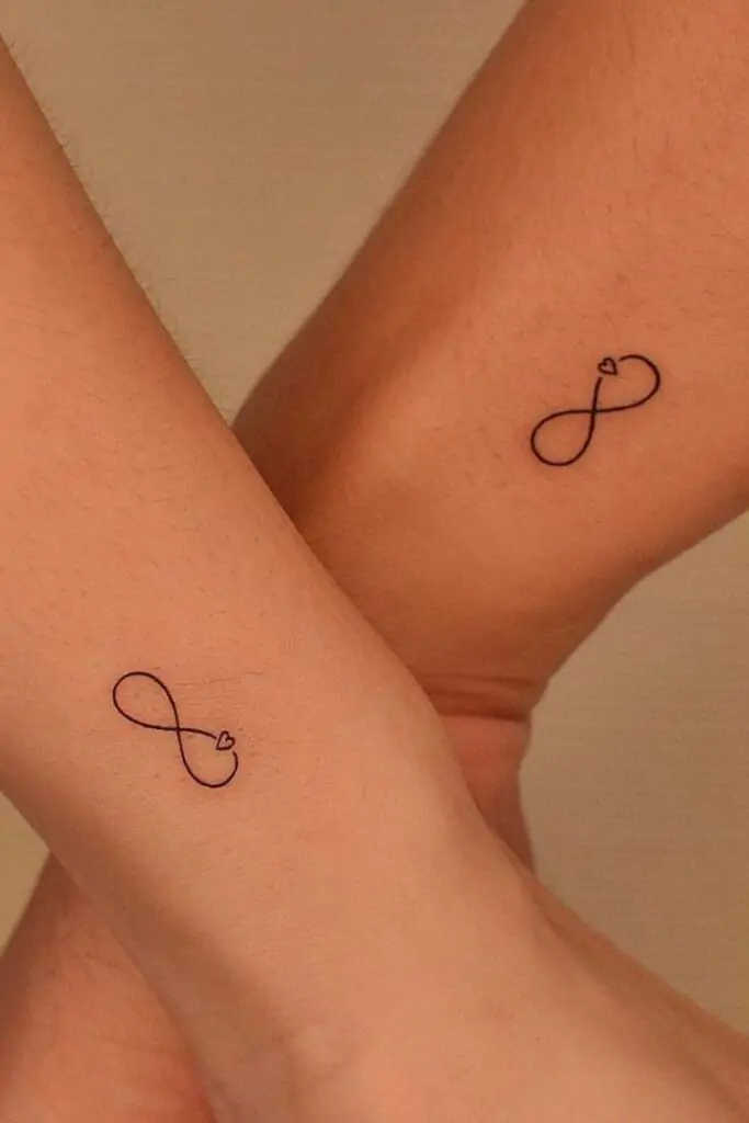 The infinity symbol is a simple yet powerful design representing eternity, endless love, or boundless possibilities. It's a popular choice for minimalist tattoos. minimalist infinity tattoo, small infinity tattoo ideas, simple infinity tattoos