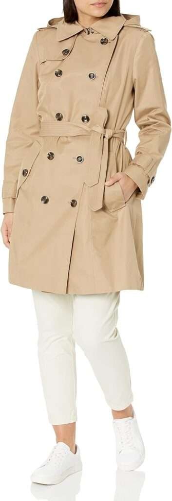 LONDON FOG Women's Double Breasted Trenchcoat. The petite trench coat, typically ending around the hips, is perfect for those who favor a relaxed yet stylish look. This short-length trench is ideal for transitioning between seasons, offering a lightweight, easy-to-layer option without overwhelming your outfit.