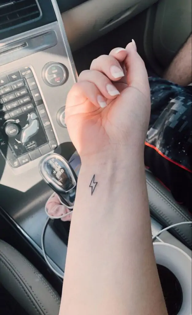 A small lightning bolt tattoo is a striking design that symbolizes power, energy, and inspiration. It's a great choice for those who want a bold yet minimalist look.minimalist lightning tattoo, small bolt tattoo ideas, simple lightning tattoos