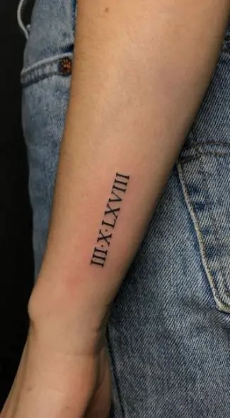 Roman numerals can represent important dates or numbers in your life. A minimalist Roman numeral tattoo is a subtle yet meaningful way to keep those moments close. minimalist Roman numeral tattoo, small date tattoo designs, simple numeral tattoos