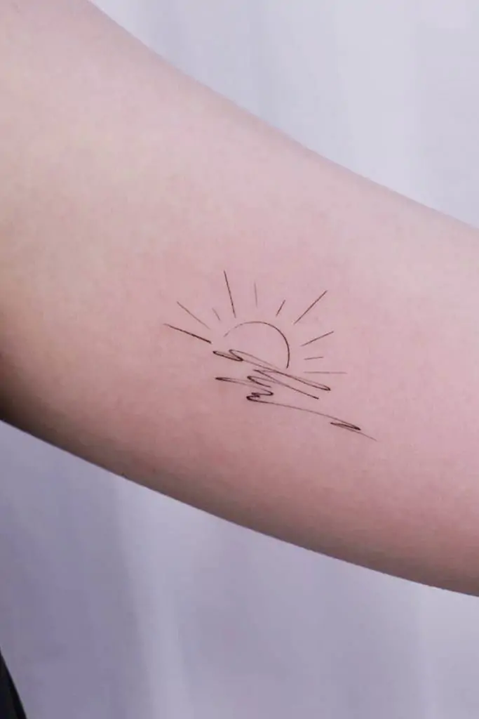 A small sun tattoo can symbolize life, energy, and positivity. It's a great way to bring a little brightness to your life every day.minimalist sun tattoo, small sun tattoo designs, simple sun tattoos