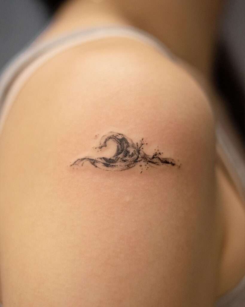 For those who feel at peace by the ocean, a simple wave tattoo is a perfect way to carry that connection with you. It symbolizes fluidity, change, and tranquility.minimalist wave tattoo, small ocean tattoo ideas, simple wave tattoos