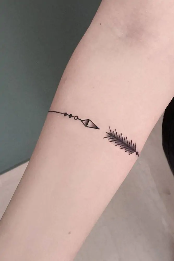 Arrows are popular in minimalist tattoo designs because they symbolize direction, focus, and moving forward. A simple arrow on your forearm or behind your ear can be a constant reminder to stay on your path. minimalist arrow tattoo, small arrow tattoo ideas, simple arrow tattoos