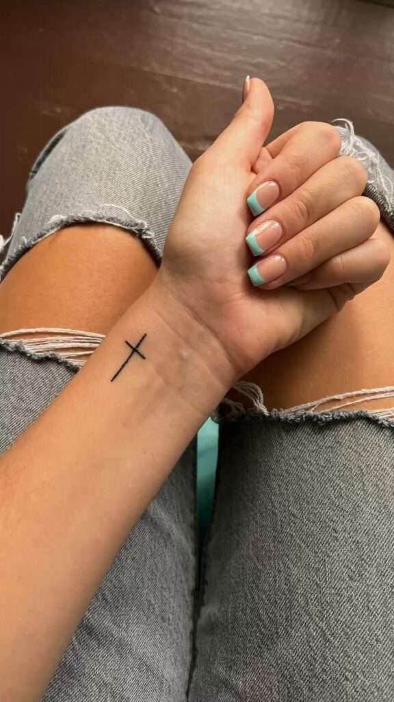 A minimalist cross tattoo is a powerful symbol of faith, spirituality, and protection. It can be placed almost anywhere on the body and looks elegant in a simple design.minimalist cross tattoo, small cross tattoo ideas, simple religious tattoos