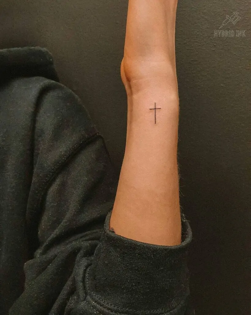 A minimalist cross tattoo is a powerful symbol of faith, spirituality, and protection. It can be placed almost anywhere on the body and looks elegant in a simple design.minimalist cross tattoo, small cross tattoo ideas, simple religious tattoos