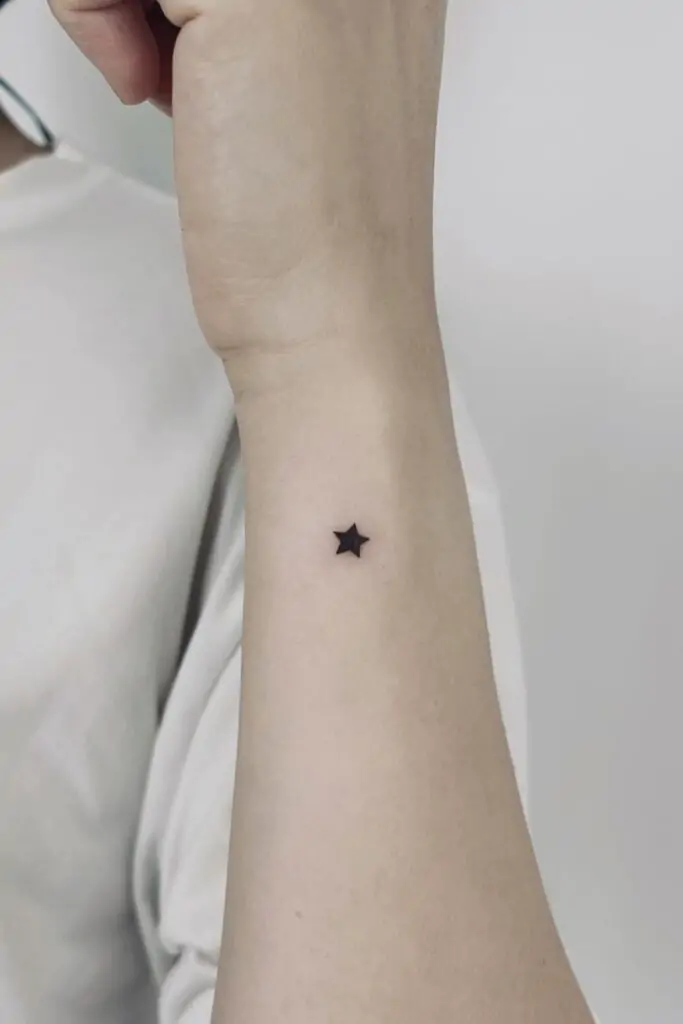 Stars are a timeless tattoo design that represents hope, guidance, and dreams. A single star or a small cluster of stars can look stunning as a minimalist tattoo.