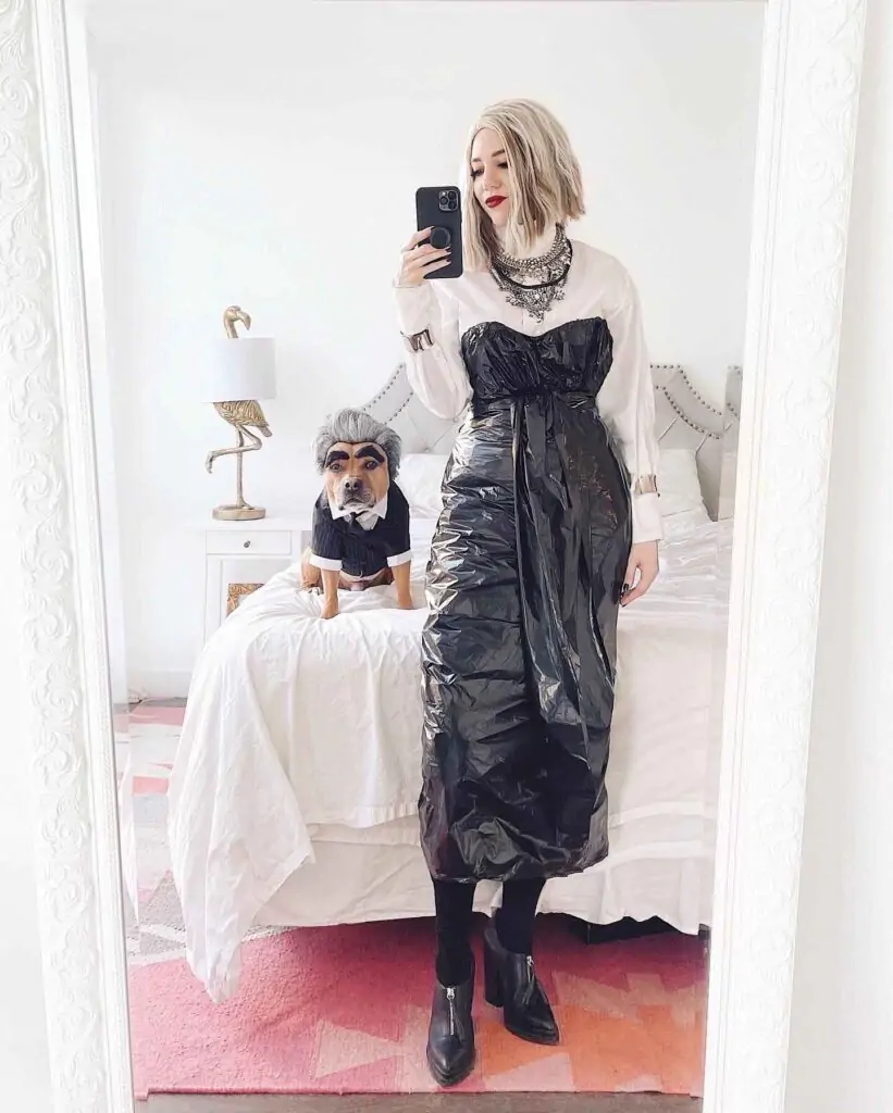 Glamorous Recycler Halloween costume. We'll call it "Glamorous Recycler." People dig Halloween costumes like this for the originality and eco-friendliness. Plus, resourcefulness in costume choices is always a hit for creativity and wit.Your Halloween look: a black trash bag dress over a white shirt, with bold necklaces and ankle boots, is pure genius.