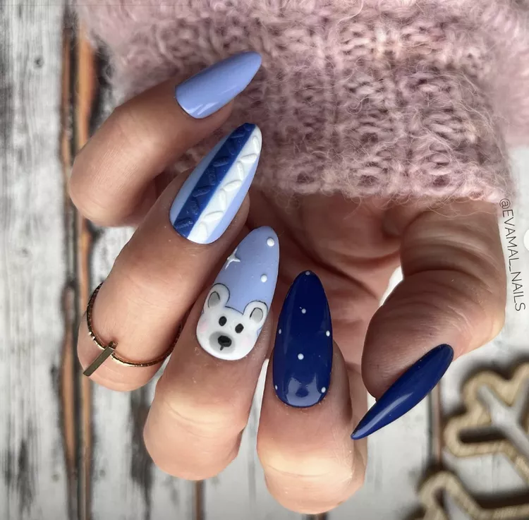 Polar bears have to be one of the cutest winter animals out there, so why not put them on your nails to admire? Opt for a paint chip nail effect by painting each nail a different shade of blue, then draw on a cute polar bear face as an accent nail. 