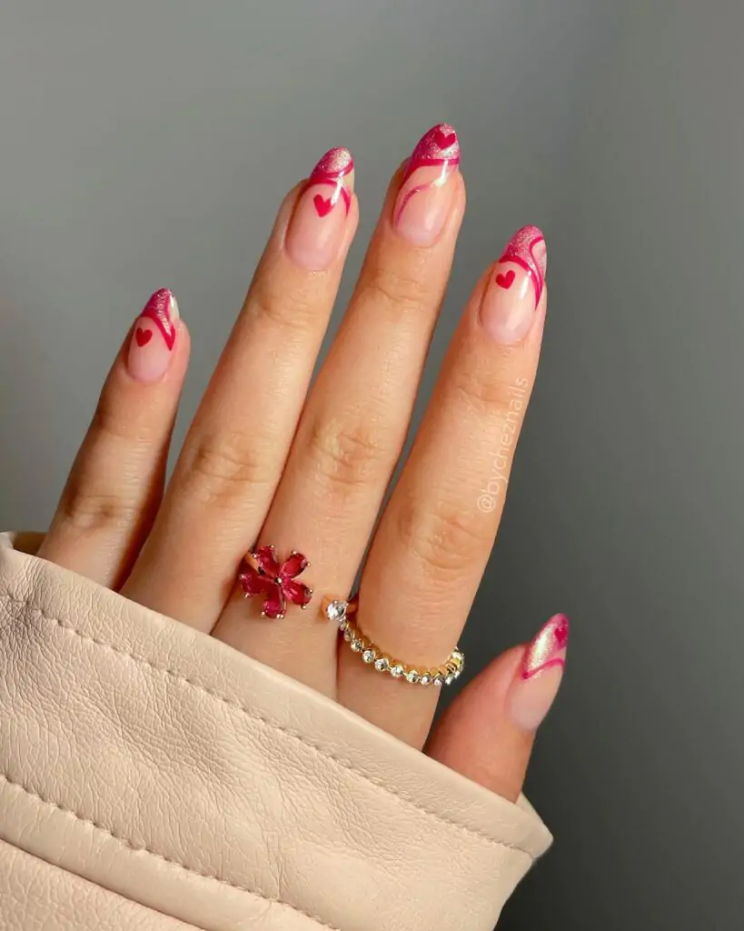 These nails are so dreamy! The way the pink and gold swirl together is like something out of a fairytale. And those little hearts peeking through? So romantic! I feel like I'd get compliments on these all day long.