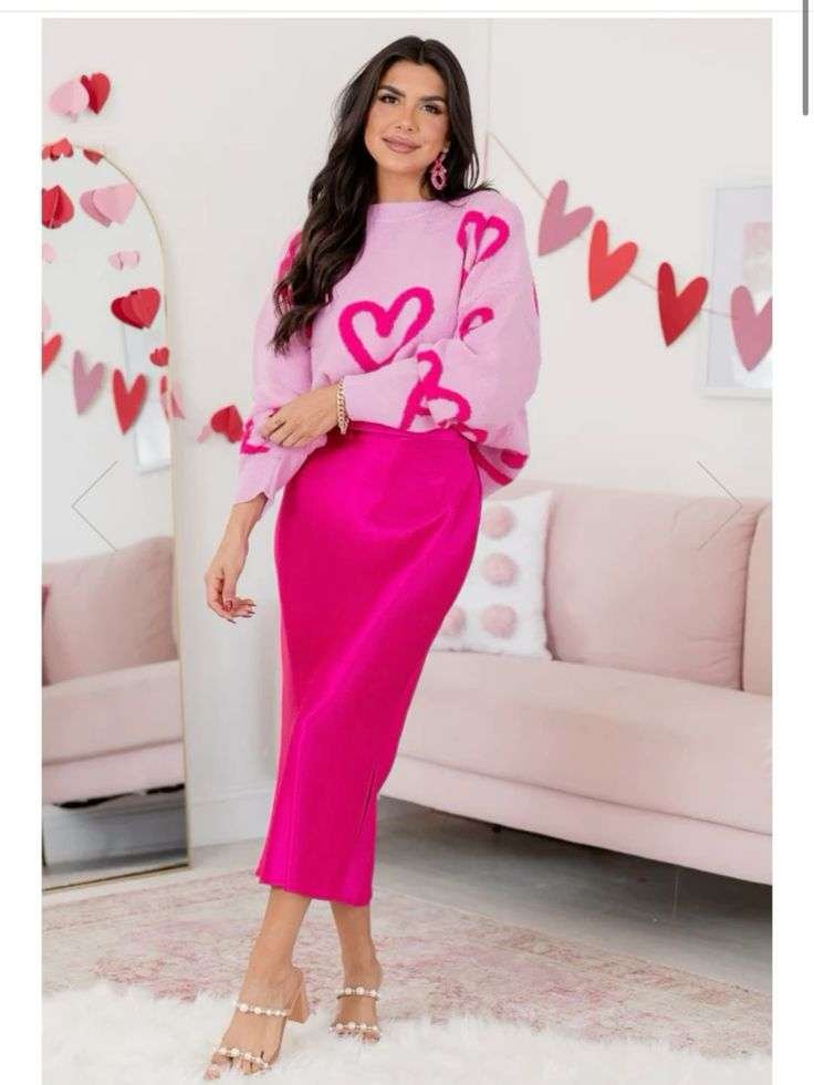 Turn heads this Valentine's Day with a striking pink heart sweater and vibrant fuchsia skirt combo, perfect for a romantic date night and Instagram-worthy moments.