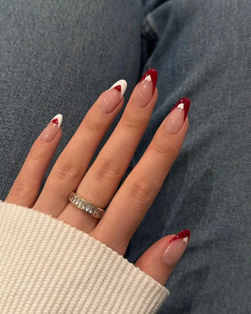 These nails are so romantic! The classic French tip gets a playful upgrade with a touch of red and those adorable little hearts. It's a subtle way to show your love for Valentine's Day, and it's elegant enough to wear all year round.