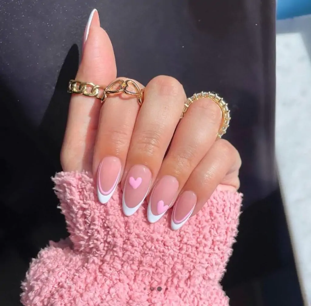 OMG, these nails are so cute! I love the classic French tip, but the little pink hearts add such a fun touch. It's like a grown-up version of those heart stickers we used to put on our notebooks in elementary school! They're perfect for spring or just any time you want to feel a little extra girly.