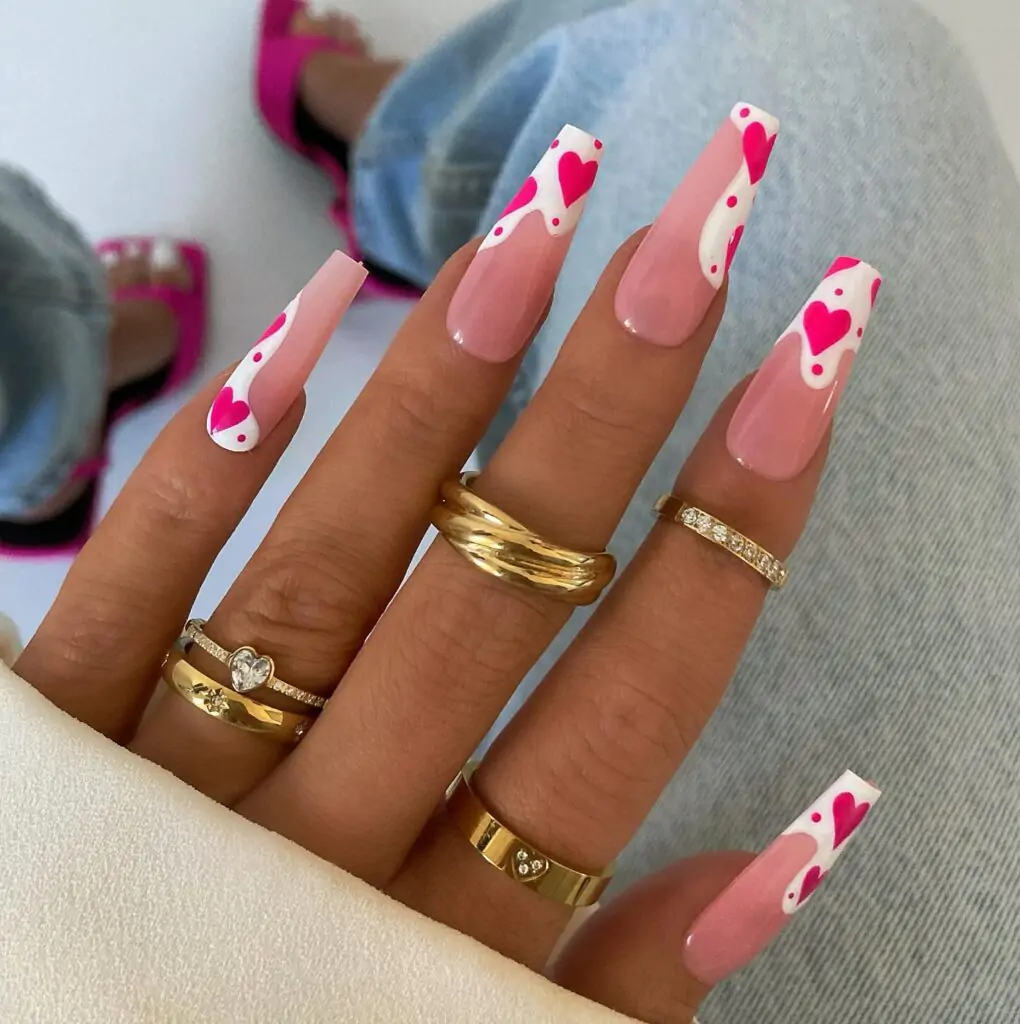 OMG, these nails are EVERYTHING! I love the way the hearts drip down the French tip - it's so playful and unique. The pink and white combo is just dreamy. I feel like I could wear these all year round and never get tired of them!