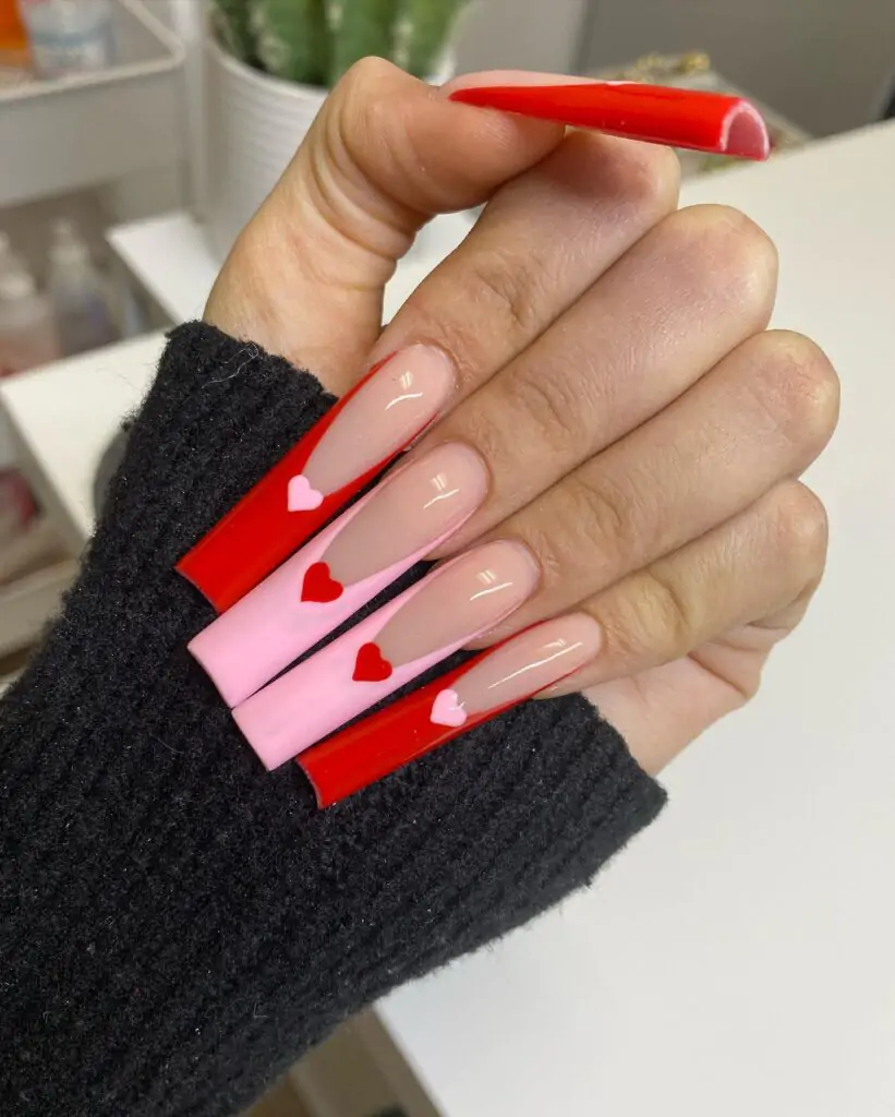 Okay, these are fierce! I love the long, sharp shape and the way the red and pink are layered. Those little heart cutouts are so unexpected and totally on-trend. Definitely a statement look for someone who isn't afraid to stand out!