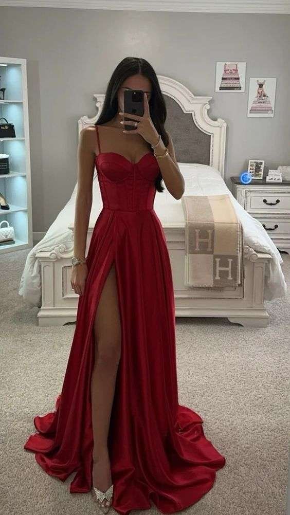 Turn heads this Valentine's Day in a stunning red gown with a daring thigh-high slit, perfect for an unforgettable romantic evening.