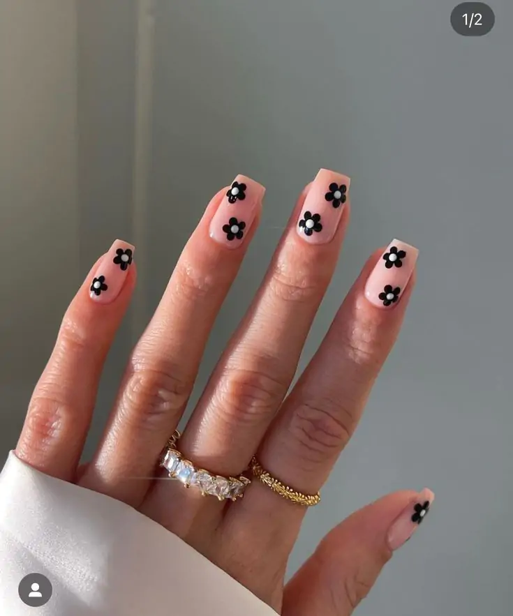 Absolutely loving these square nude nails with tiny black flowers. I’m excited to keep creating ideas for you, and here is another one! Try this trendy spring design for your next mani.