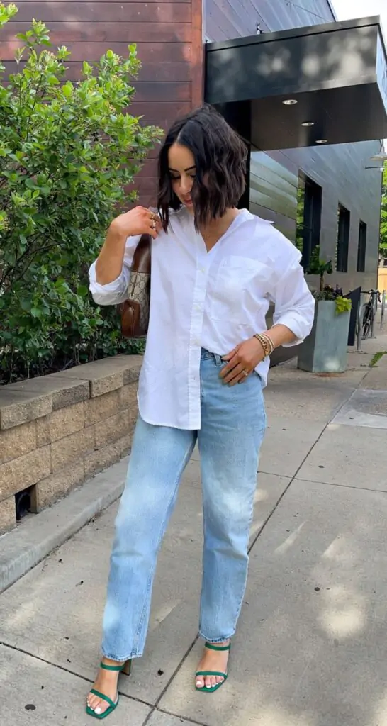 Outfit Idea: A crisp white button-down shirt tucked into high-waisted, wide-leg denim jeans. Pair it with a cute straw hat, chunky sneakers, and oversized sunglasses. Why It Works: Effortless yet elevated; perfect for spring days that require minimal effort but still look polished. The wide-leg jeans are trending and are perfect for both comfort and style.