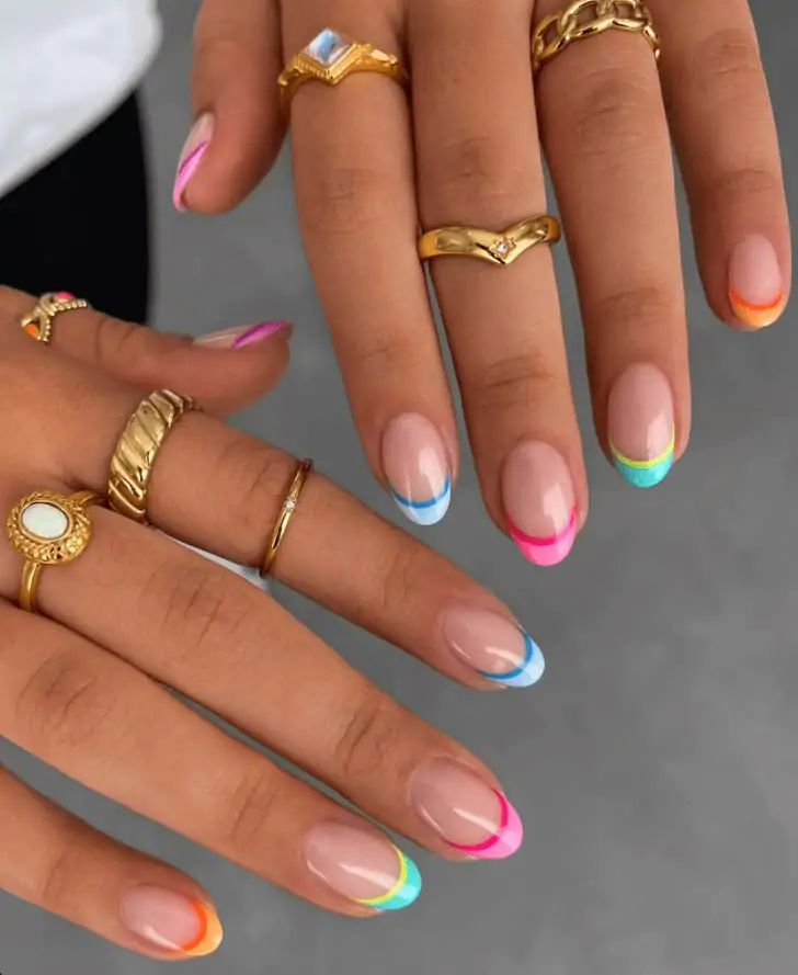Can’t wait for you to rock this fun mani at your next spring outing. Obsessed with these vibrant rainbow-tipped nails—you’ll feel so playful and bold with this colorful look!