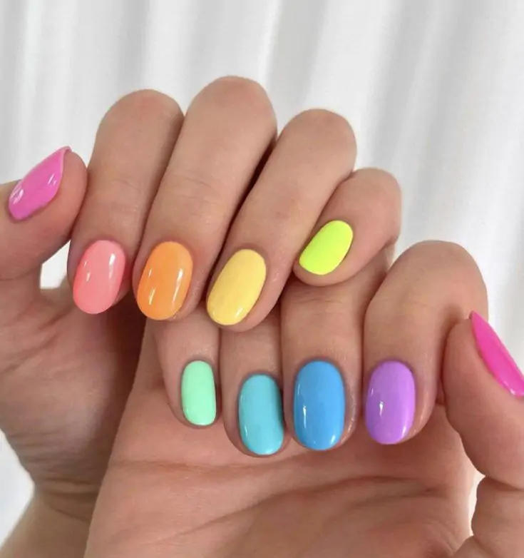 These playful mani's will brighten up your spring days. With these bold, colorful nails in shades of pink, purple, blue, and lime—you’ll feel so lively with this look! These playful nail designs will brighten up your spring days.