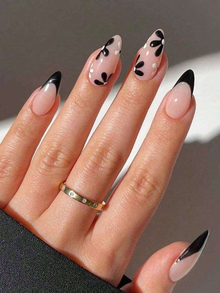 You’ll feel so trendy wearing this bold look! We know this chic design will inspire your next salon visit. I’m totally obsessed with these sleek black-tipped nails paired with cute white daisies.