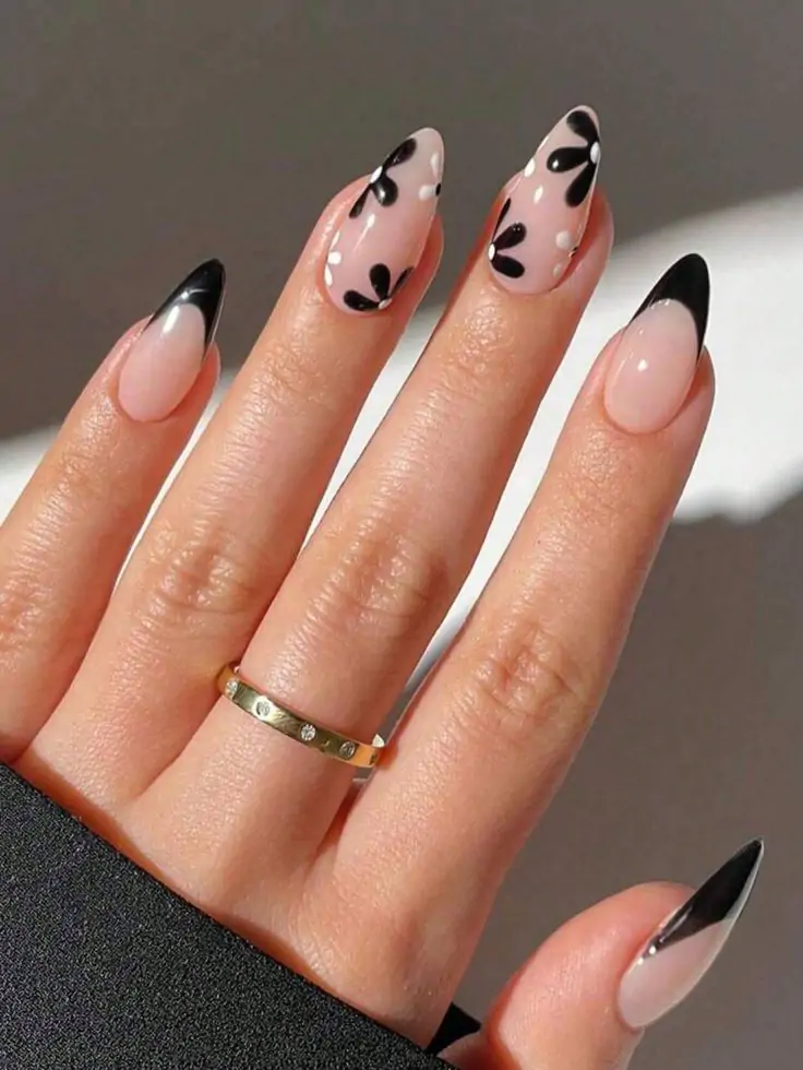 You’ll feel so trendy wearing this bold look! We know this chic design will inspire your next salon visit. I’m totally obsessed with these sleek black-tipped nails paired with cute white daisies.
