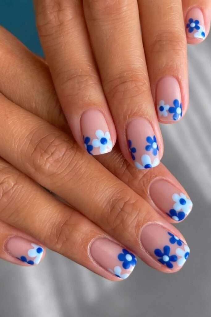 You’ll love how these nude nails pop with playful blue daisies—I can’t get enough of this fresh, floral vibe! We’re totally inspired to try this chic design for our next mani moment.