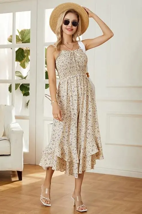 Flattering strappy maxi dress features a vivid floral print, elastic smocked design, open back, Adjustable Buttons Straps and lovely tiered ruffles. Meet your fantasies and expectations of summer.