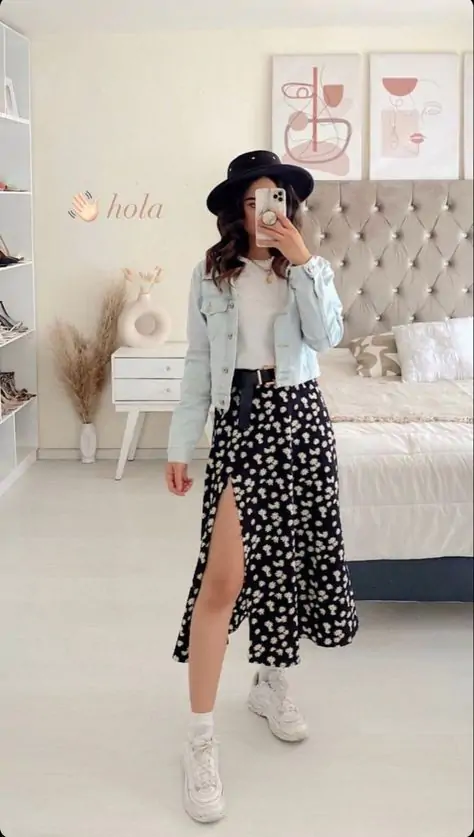 A floral midi skirt paired with a fitted denim jacket and white sandals. Accessorize with a floppy hat and simple jewelry. Why It Works: A mix of relaxed and feminine, this outfit is perfect for everything from a day trip to a casual outdoor gathering. The floral skirt screams spring, while the denim jacket gives it a cool edge.