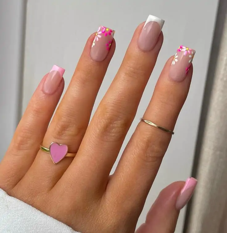 I’m obsessed with how this luxury manicure captures the season’s vibe—don’t you just love this nail design inspiration? Below are some more looks with different color and styles. These chic spring nails bloom with a soft nude base and delicate floral tips, perfect for a fresh, trendy nail art look!