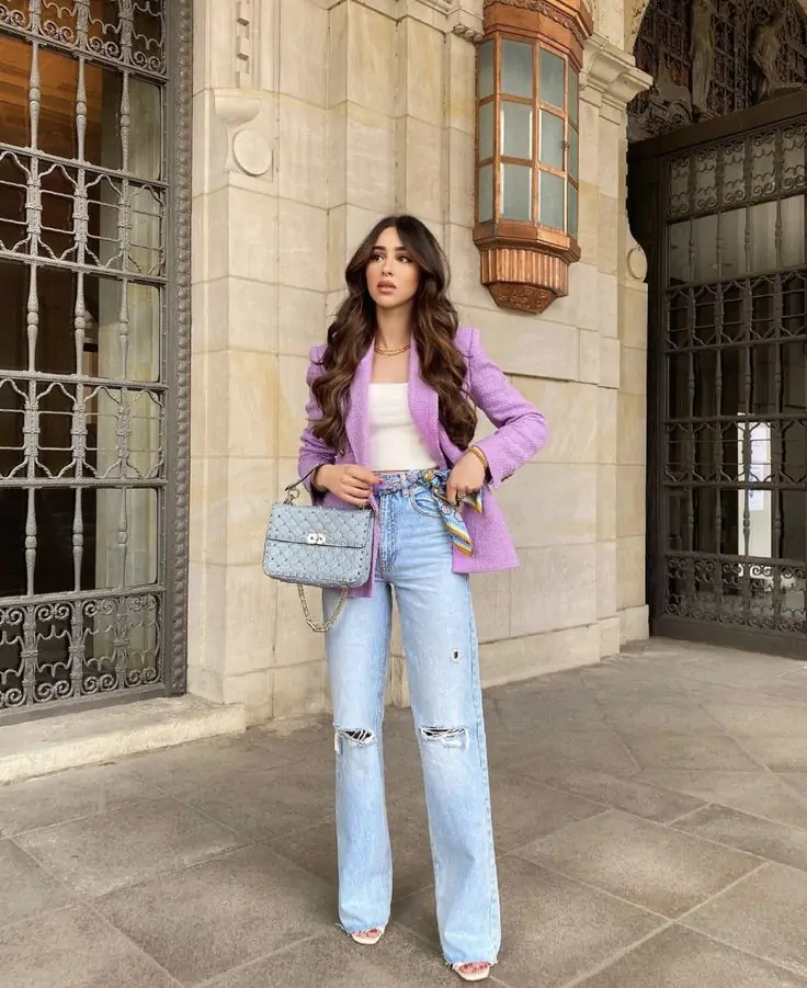A pastel blazer worn over a neutral white blouse and high-waisted skirt. Finish with nude heels or white ankle boots for a sophisticated touch. Why It Works: This look exudes professional elegance, making it ideal for spring office wear or an important meeting. The pastel adds a fun pop of color without being overpowering.