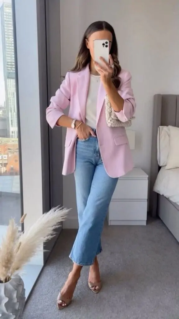A pastel blazer worn over a neutral white blouse and high-waisted skirt. Finish with nude heels or white ankle boots for a sophisticated touch. Why It Works: This look exudes professional elegance, making it ideal for spring office wear or an important meeting. The pastel adds a fun pop of color without being overpowering.