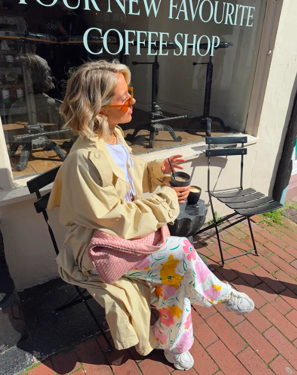 A chunky knit sweater paired with tailored cropped pants and ankle boots. Add a trench coat for a stylish layer. Why It Works: Spring can still bring chilly days, so layering is key. This outfit is perfect for cooler mornings or evenings and can be easily transitioned as the day warms up.