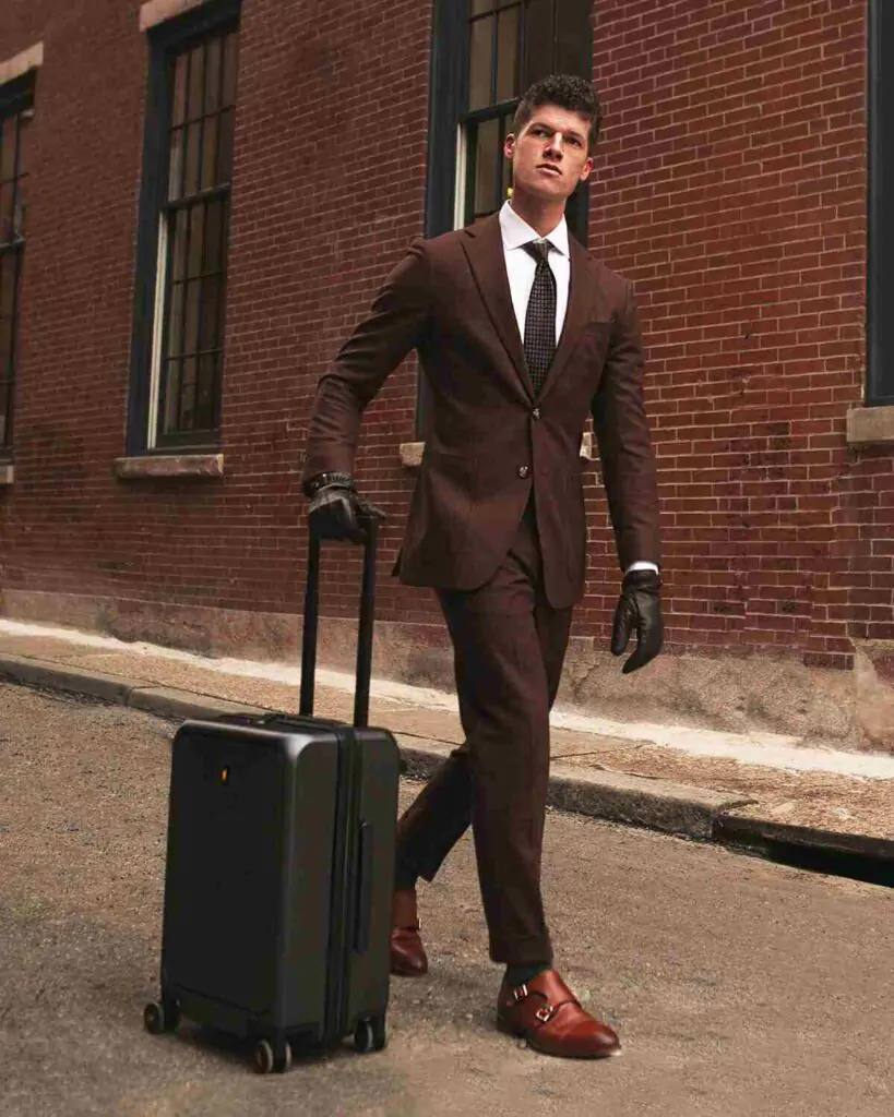 This carry-on merges sleek design with functionality, featuring a padded front pocket for a 15.6" laptop and a built-in USB port for on-the-go charging. Crafted from durable German Makrolon® polycarbonate, it offers ultra-quiet 360° spinner wheels and a TSA-approved lock for smooth and secure travels. 