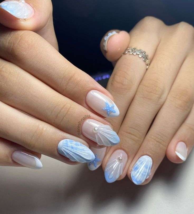 With summer months comes relaxing days at the beach—and manicures that match the views. "The beach trends and seashell trends are really fun for me for summer," says Gerstein. From realistic seashell nails made from 3D gel, to a classic ocean blue polish, this summer is all about "mermaid vibes." With deep blue nails specifically, she notes, "It’s universal and seems underrated because it might not seem as trendy, but it’s more of a staple and part of the core of what summer feels like."