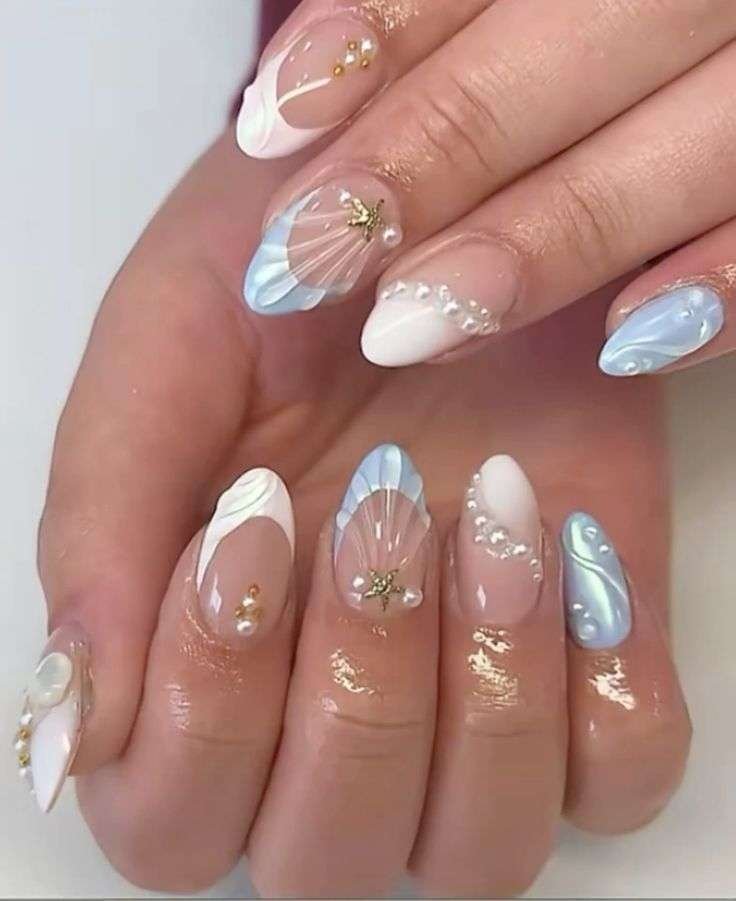 With summer months comes relaxing days at the beach—and manicures that match the views. "The beach trends and seashell trends are really fun for me for summer," says Gerstein. From realistic seashell nails made from 3D gel, to a classic ocean blue polish, this summer is all about "mermaid vibes." With deep blue nails specifically, she notes, "It’s universal and seems underrated because it might not seem as trendy, but it’s more of a staple and part of the core of what summer feels like."