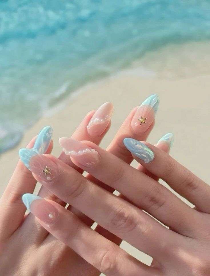 With summer months comes relaxing days at the beach—and manicures that match the views. "The beach trends and seashell trends are really fun for me for summer," says Gerstein. From realistic seashell nails made from 3D gel, to a classic ocean blue polish, this summer is all about "mermaid vibes." With deep blue nails specifically, she notes, "It’s universal and seems underrated because it might not seem as trendy, but it’s more of a staple and part of the core of what summer feels like."